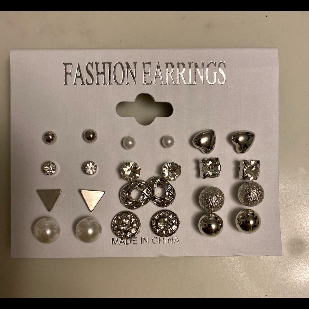 Set of 12 pairs of silver plated stud earrings.